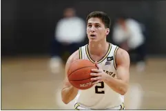  ?? MATT SLOCUM — THE ASSOCIATED PRESS ?? Villanova’s Collin Gillespie has been ruled out of the NCAA Tournament with a knee injury, but the senior is still doing his part from the sideline.