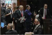  ?? OHAD ZWIGENBERG — THE ASSOCIATED PRESS ?? Israeli Prime Minister Benjamin Netanyahu enters the Knesset, Israel's parliament, in Jerusalem on Tuesday.