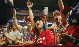  ??  ?? Attendees cheer while Donald Trump speaks during his campaign rally at The BOK Center in Tulsa, Oklahoma. Photograph: Ian Maule/AP