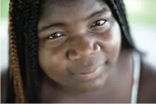  ?? Associated Press ?? below
Takiyah Coleman 19, who organized a Black Lives Matter protest poses for a portrait Aug. 4 in Anna, Ill. “Sundown towns” like Anna were places where Black people were allowed in during the day to work or shop but had to be gone by nightfall.