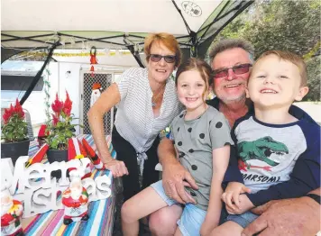  ?? Picture: MIKE DUGDALE ?? COASTAL CHRISTMAS: Jeff and Barb Nunn travel from Ouyen to have Christmas at the Barwon Heads Caravan Park with family, including grandkids Henry and Willow Mifsud.