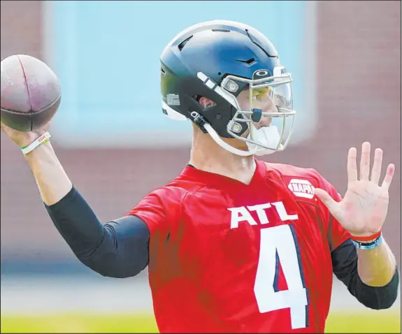  ?? John Bazemore The Associated Press ?? Atlanta Falcons quarterbac­k Desmond Ridder, a third-round draft pick, throws a pass during the team’s rookie minicamp Saturday.