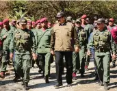  ?? VENEZUELAN PRESIDENCY / AFP / GETTY IMAGES ?? Venezuelan President Nicolas Maduro, centre, attends military exercises on Friday, amid calls for new elections. CUPE, a major Canadian union, announced its support for Maduro, in opposition to the federal government siding with his rival, Juan Guaido.