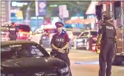  ?? FRANK GUNN — THE CANADIAN PRESS VIA AP ?? Police work at the scene of the shooting attack that killed two and wounded 13 in Toronto on Sunday.