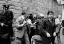  ?? Ron Edmonds/AP ?? Secret Service agents and police officers swarm Hinckley after he tried to assassinat­e Ronald Reagan outside the Washington Hilton on 30 March 1981. Photograph:
