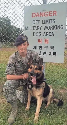  ?? AMANDA CUBBAGE ?? Sgt. Amanda Cubbage and her military working dog, Rick, pose for a photo in South Korea.