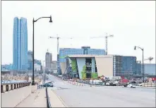  ?? HOKE/ THE OKLAHOMAN] ?? The 17-story Omni Hotel and the Oklahoma City Convention Center are seen looking north on Robinson Avenue from Interstate 40. [DOUG