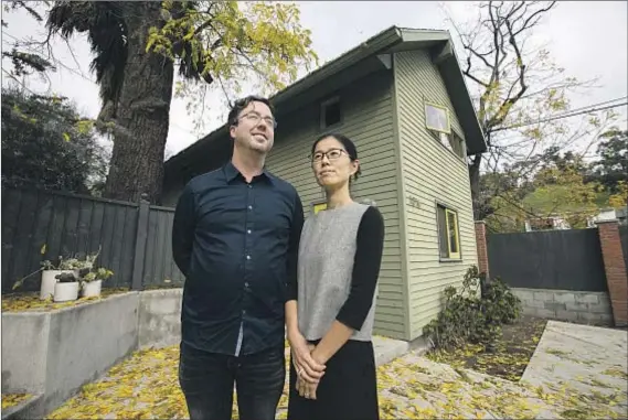  ?? Jason Armond Los Angeles Times ?? THE HUSBAND-AND-WIFE design team of Bo Sundius and Hisako Ichiki outside one of their accessory dwelling units in L.A.