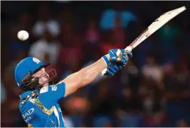  ??  ?? (Right) Mumbai Indians batsman Jos Buttler plays a shot during the match played against Rising Pune Supergiant­s (Left) Mumbai Indians’ Parthiv Patel also gets in on the act