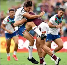  ?? GETTY IMAGES ?? The Warriors’ Paul Turner is stopped in his tracks by Sean Keppie, of the Sea Eagles, during their round nine NRL match in Sydney yesterday.