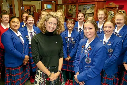  ?? JOHN HAWKINS/ STUFF ?? British High Commission­er Laura Clarke with Southland Girls’ High School student Briana Miller, 17, and other students, after giving a speech at the school to mark the 125th anniversar­y of women’s suffrage in New Zealand.