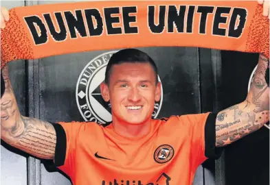  ??  ?? TANGERINE DREAM Aird shows off his new colours at Tannadice yesterday after turning his back on Pars to join United