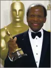  ?? DOUG MILLS — THE ASSOCIATED PRESS, FILE ?? Sidney Poitier poses with his honorary Oscar trophy during the 74th annual Academy Awards in Los Angeles on March 24, 2002. Arizona State University has named its new film school after Poitier.