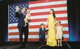  ?? REBECCA BLACKWELL/AP ?? Gov. Ron DeSantis, his wife, Casey DeSantis, and their children walk on stage to celebrate victory over Rep. Charlie Crist on Nov. 8, in Tampa.