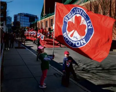  ?? MATTHEW J. LEE/GLOBE STAFF ?? Reading’s Elizabeth Gipson, 7, was among those who trekked to Fenway on Monday to see off the team’s equipment truck as it began the drive south for Florida and spring training.