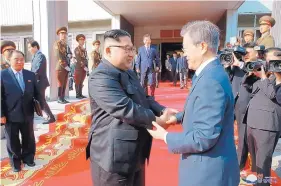  ?? SOURCE: NORTH KOREA ?? North Korean leader Kim Jong Un, left, and South Korean President Moon Jae-in, right, shake hands after their meeting at the northern side of Panmunjom in North Korea.