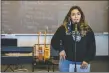  ?? ?? Angelica Lovato, senior, sings during mariachi band rehearsal Monday (Nov. 8) at Questa Junior/ Senior High School.