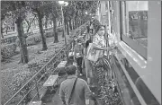  ?? AFP ?? Commuters getting on a train at a station in between Bangkok Railway Station, more commonly known as Hua Lamphong, and Bang Sue Grand Station, in Bangkok.