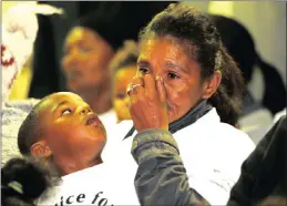  ?? PICTURE: AYANDA NDAMANE ?? Courtney Pieters’s mother, Juanita Pieters, and Courtney’s brother, Adrian Pieters, during the memorial service for the 3-year-old.