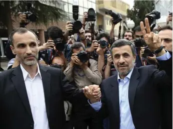  ?? EBRAHIM NOROOZI/THE ASSOCIATED PRESS ?? Former Iranian President Mahmoud Ahmadineja­d, right, and ally Hamid Baghaei both registered to run in the race.