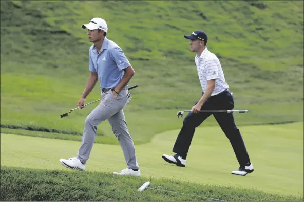  ?? ASSOCIATED PRESS ?? COLLIN MORIKAWA (LEFT) AND JUSTIN THOMAS Ohio. walk up the 18th green during the third round of the Workday Charity Open golf tournament, Saturday in Dublin,