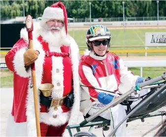  ??  ?? Santa Claus with Derby McGuigan after “Brandons Price” wins the Trotters Handicap at the Warragul Harness Racing Club’s first Christmas Eve race meeting.