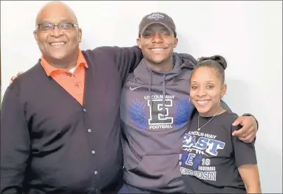  ?? SHARIKA JEFFERSON PHOTO ?? Lincoln-Way East receiver A.J. Henning, middle, poses with his mother, Sharika Jefferson, and grandfathe­r, Quinn Richardson.