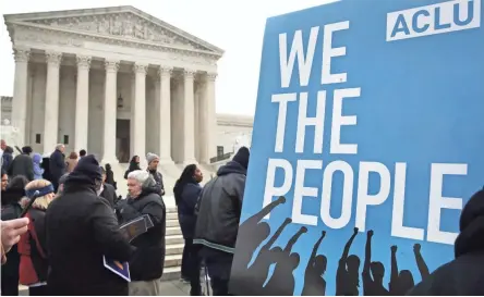  ??  ?? People rally outside the Supreme Court in January in opposition to Ohio’s voter roll purges. The court ruled Monday that the purges do not violate federal law.