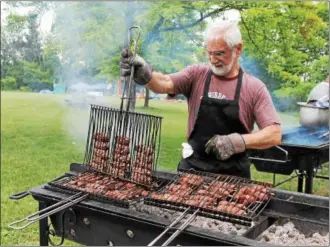  ?? FILE PHOTO ?? Kebobs are on the grill at the 2016Armeni­an Festival.