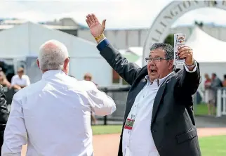  ?? HAGEN HOPKINS/GETTY IMAGES ?? Part-owner Phil Bentley, right, celebrates the win of Enzo’s Ladin the Telegraph on Saturday.