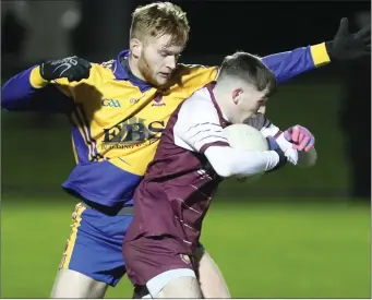  ??  ?? Bush PP’s James McDonnell won a free after this challenge by Karl Martin for St Mary’s DS.