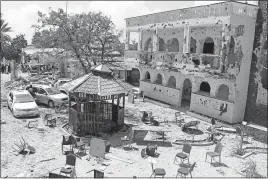  ?? [THE ASSOCIATED PRESS] ?? The Asasey Hotel in Kismayo, Somalia, shows the damage left Saturday by the Friday evening attack by Islamic extremists and the overnight siege by Somali forces. The hotel was frequented by politician­s and Somali expatriate­s; a former Columbus resident who had flown back to Somalia from the United States on Friday was among those killed.