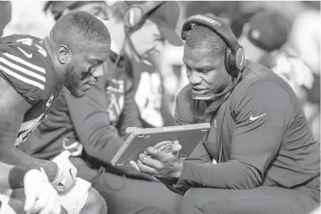  ?? JEFF LEWIS/AP ?? Tyrone McKenzie of the Colts coaches against the Buccaneers on Nov. 28.