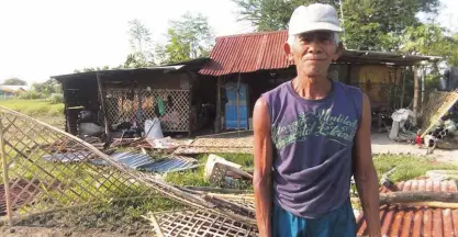  ?? CONTRIBUTE­D PHOTO ?? HIS CROPS bulldozed in March, farmer Charlito “Gerry” Catalan lost his fence to a demolition team inside Hacienda Luisita. Catalan insists the land is his, having tilled it since 2004. The DAR gave it to another beneficiar­y who leased the land to sugar...