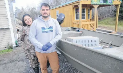  ?? AARON BESWICK • THE CHRONICLE HERALD ?? Sylvia Bernard and her partner Gary Denny with the 16-foot aluminum boat from which they fish their moderate livelihood lobster traps. Shots were fired toward Denny from a larger lobster boat that he found among his traps on Sunday.