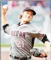  ??  ?? Zack Grienke #21 of the Arizona Diamondbac­ks throws a second inning pitch against the Atlanta Braves at SunTrust Park on July
14, in Atlanta, Georgia. (AFP)