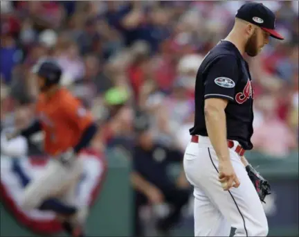  ?? DAVID DERMER — ASSOCIATED PRESS ?? Cody Allen, right, waits for the Astros’ George Springer to round the bases after Springer hit a solo home run Oct. 8.