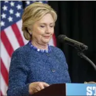  ?? THE ASSOCIATED PRESS ?? Democratic presidenti­al candidate Hillary Clinton pauses Friday while speaking at a news conference at Theodore Roosevelt High School in Des Moines, Iowa. The FBI dropped what amounts to a political bomb on the Clinton campaign on Friday when it...