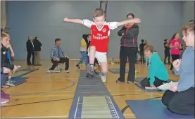  ?? 06_a04athleti­c02 ?? Action from the Lochgilphe­ad Sports Hall Athletics competitio­n in 2017.