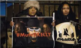  ??  ?? #MuteRKelly supporters protest outside R Kelly’s studio in Chicago. Photograph: Ashlee Rezin/AP