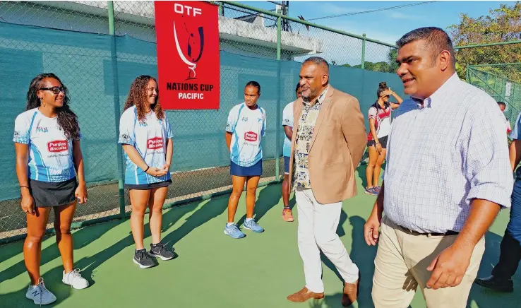  ?? Photo: Nicolette Chambers ?? Tennis Fiji president, Rajiv Singh, right, escorting the Minister for Commerce, Trade, Tourism and Transport, Faiyaz Koya to meet the players from the eight Pacific Island nations at the opening of the 2022 Pacific Nations Cup Tennis tournament at the Regional Tennis Centre at the Nadovu Park Grounds in Lautoka on August 1, 2022.