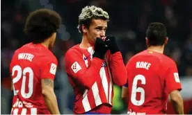  ?? Photograph: Susana Vera/Reuters ?? Antoine Griezmann kisses the club crest after becoming Atlético Madrid’s joint highest scorer.