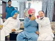  ??  ?? Congress leader Navjot Singh Sidhu being offered sweets by MLA Madan Lal Jalalpur as cabinet minister Sukhjinder Singh Randhawa looks on, in Patiala on Sunday.
