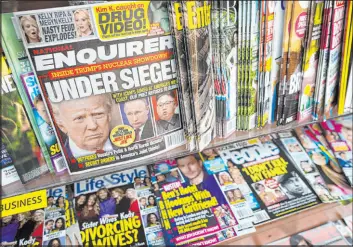  ?? The Associated Press ?? An issue of the National Enquirer tabloid featuring President Donald Trump on its cover is displayed on a newsstand inside a New York store in July 2017.