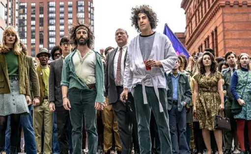 ?? Nico Tavernise/Netflix via AP ?? Foreground from left, Caitlin Fitzgerald, Jeremy Strong and Sasha Baron Cohen go to court in “The Trial of the Chicago 7.” The Netflix film is nominated for six Academy Awards.