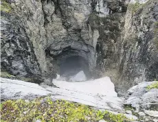  ?? TUYA TERRA GEO CORP., CATHERINE HICKSON/THE CANADIAN PRESS ?? A newly discovered cave might be the country’s largest. The entrance was nicknamed Sarlacc’s Pit by the helicopter crew that found it.