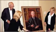  ?? Doug Walker / RN-T ?? Retired Georgia Supreme Court Chief Justice Norman Fletcher (from left) watches his daughters Elizabeth Coan and Mary Kiker unveil his official portrait.