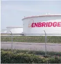  ??  ?? Enbridge Energy’s tanks at its terminal in Superior, Wisconsin. Enbridge officials said the disputed Line 3 replacemen­t should be in service in the second half of next year.