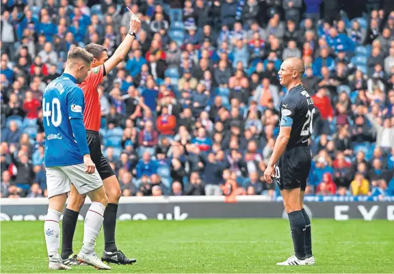  ?? Picture: SNS. ?? Veteran striker Kenny Miller is shown the red card by ref Kevin Clancy after his tackle on Rangers defender Borna Barisic.