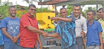  ??  ?? Qaraniqoli Farmers’ Cooperativ­e president Vinod Kumar (third from left) receives the key to their rice harvester from Minister for Agricultur­e, Mahendra Reddy (second from left) on April 6, 2021.